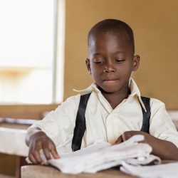 african-kid-learning-class
